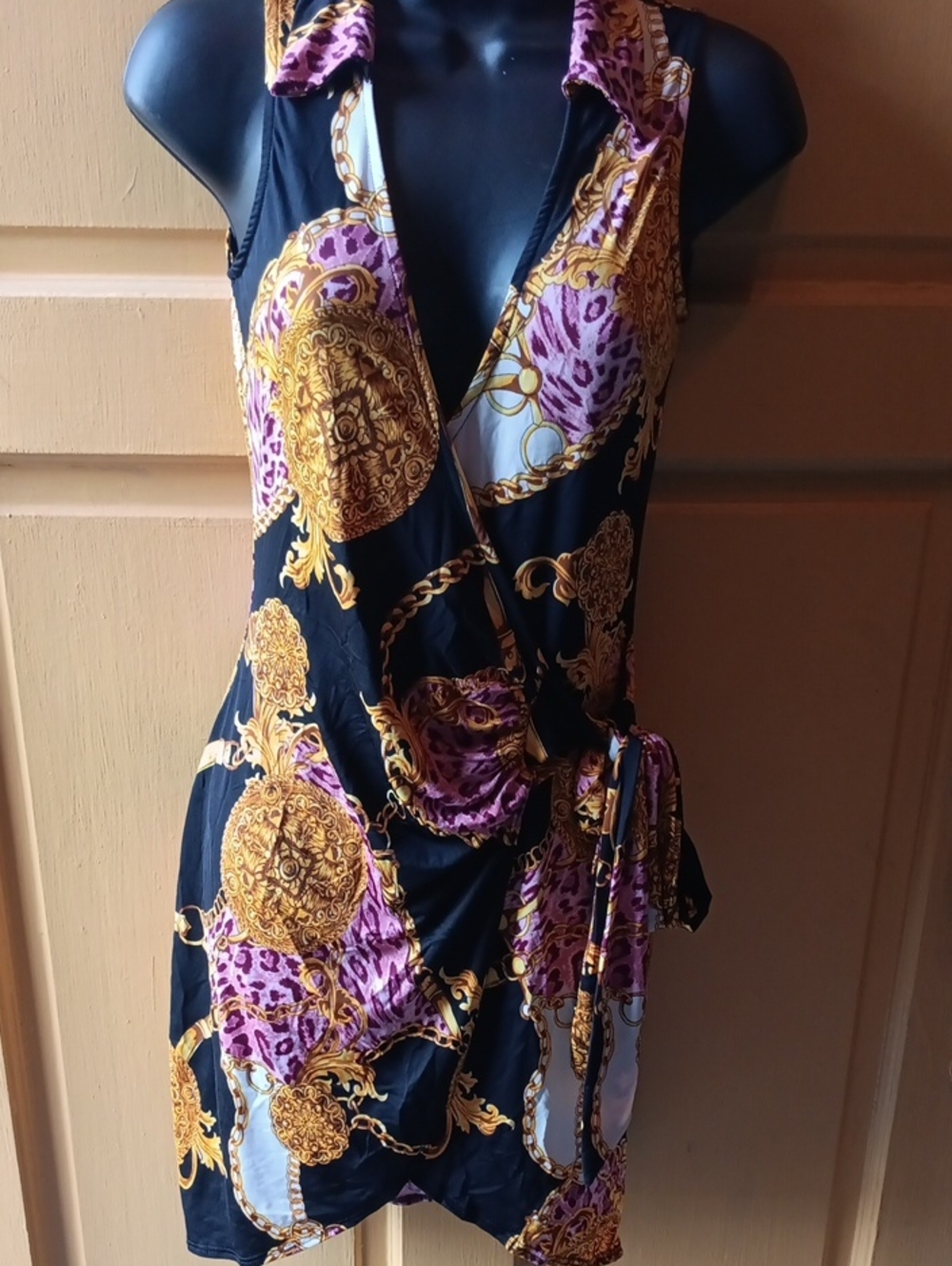 Black Wrap Dress with Gold Medallion & Purple Accents